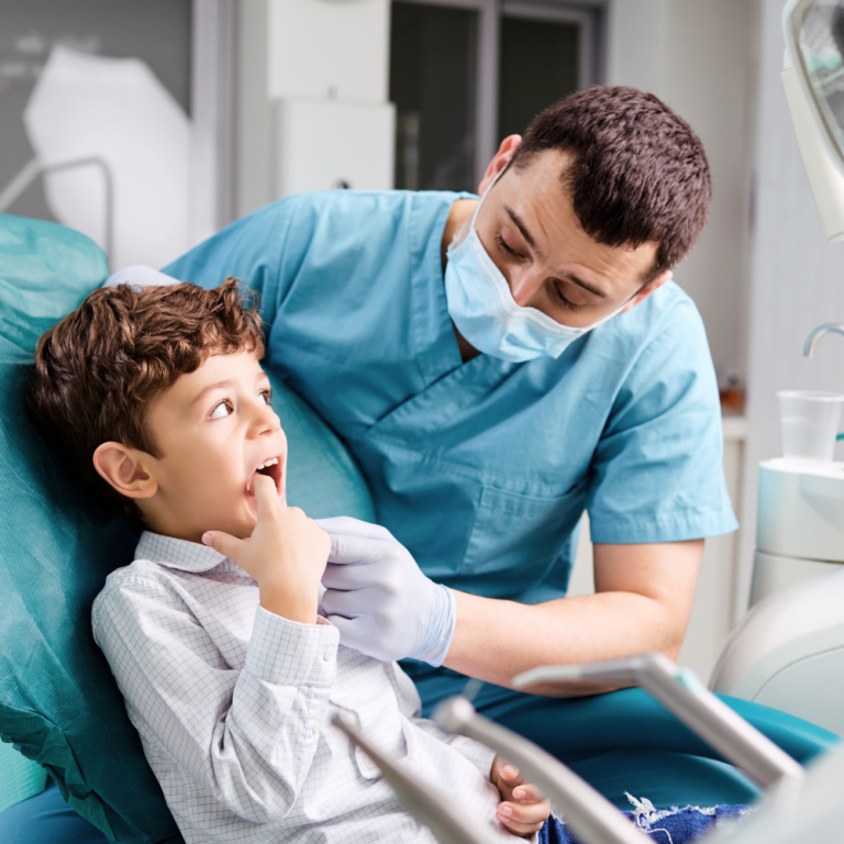 Young boy being examined by dentist