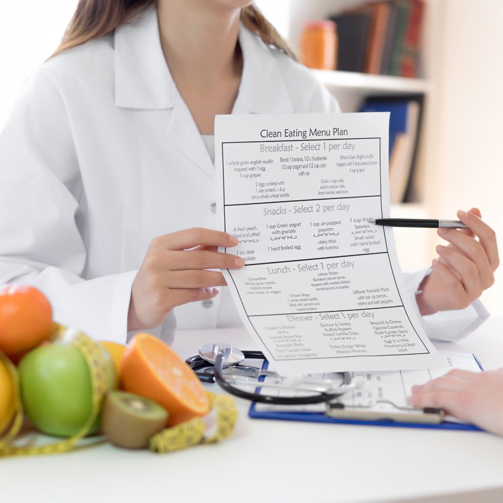 Woman holding up clean eating plan.